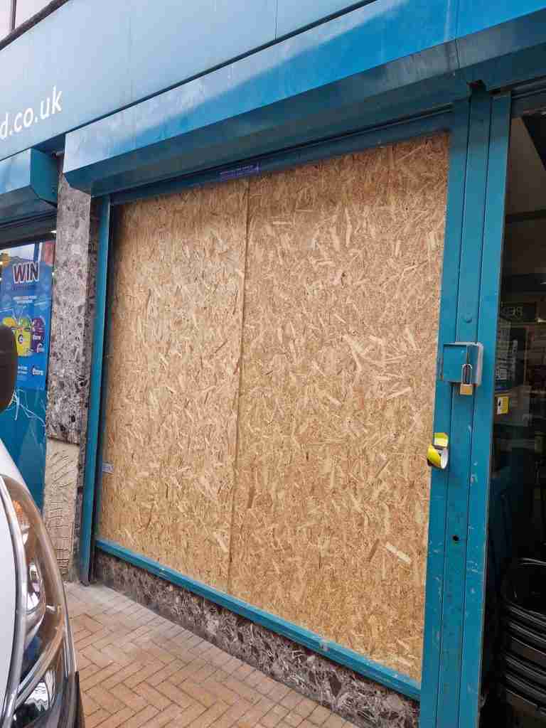 Shop Front Window Boarded Up